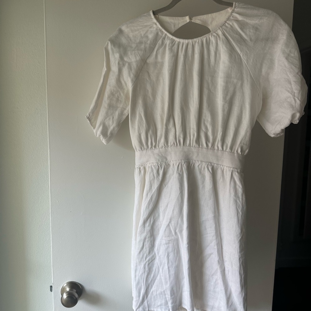 Reformation white linen dress with puff sleeves and open back.